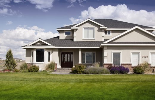 Beautiful modern design house home with blue sky and green grass